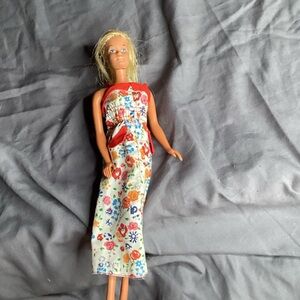 Barbie Doll with A Floral Dress with Red Accents